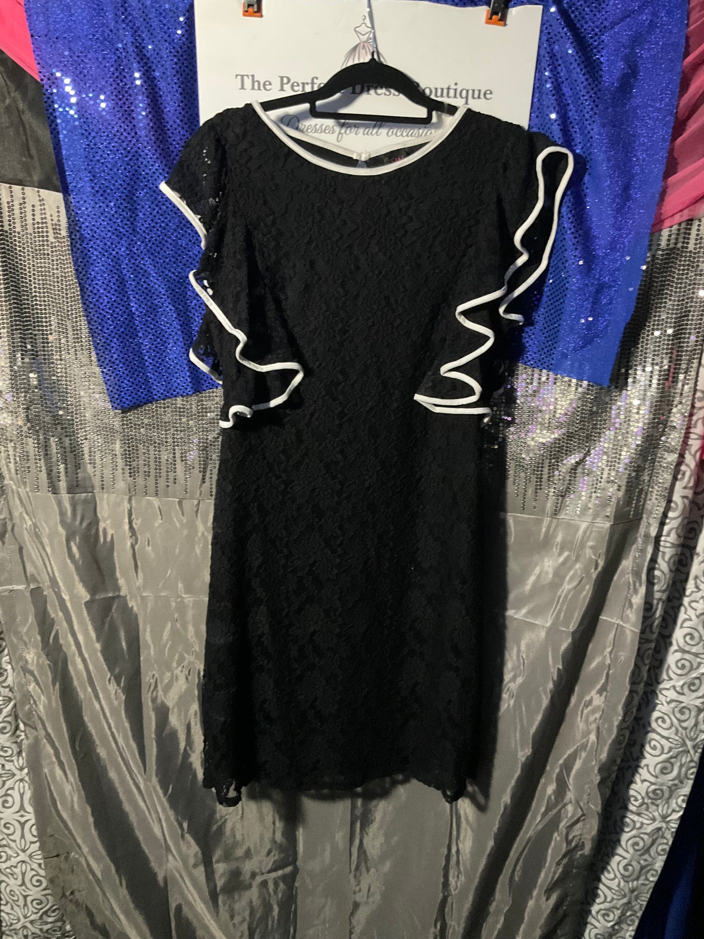 Black lace dress with white trim