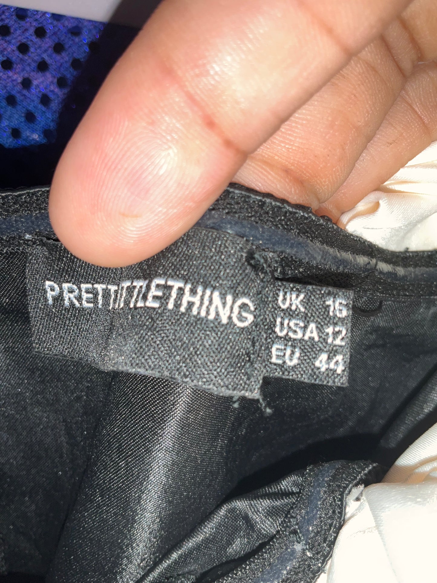 Black satin dress with white ruffles