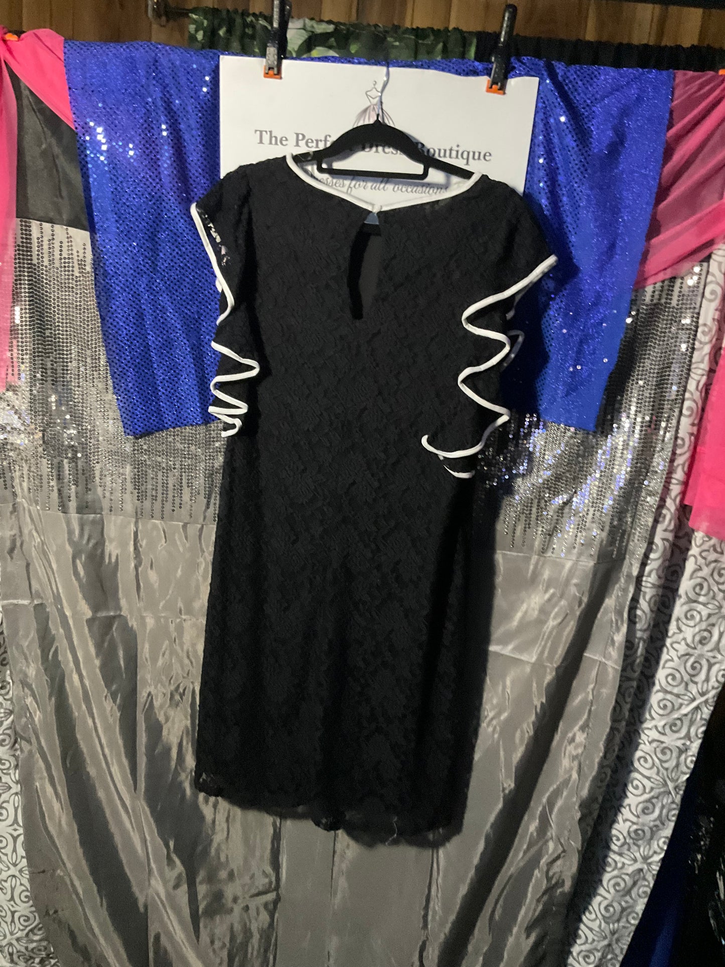 Black lace dress with white trim