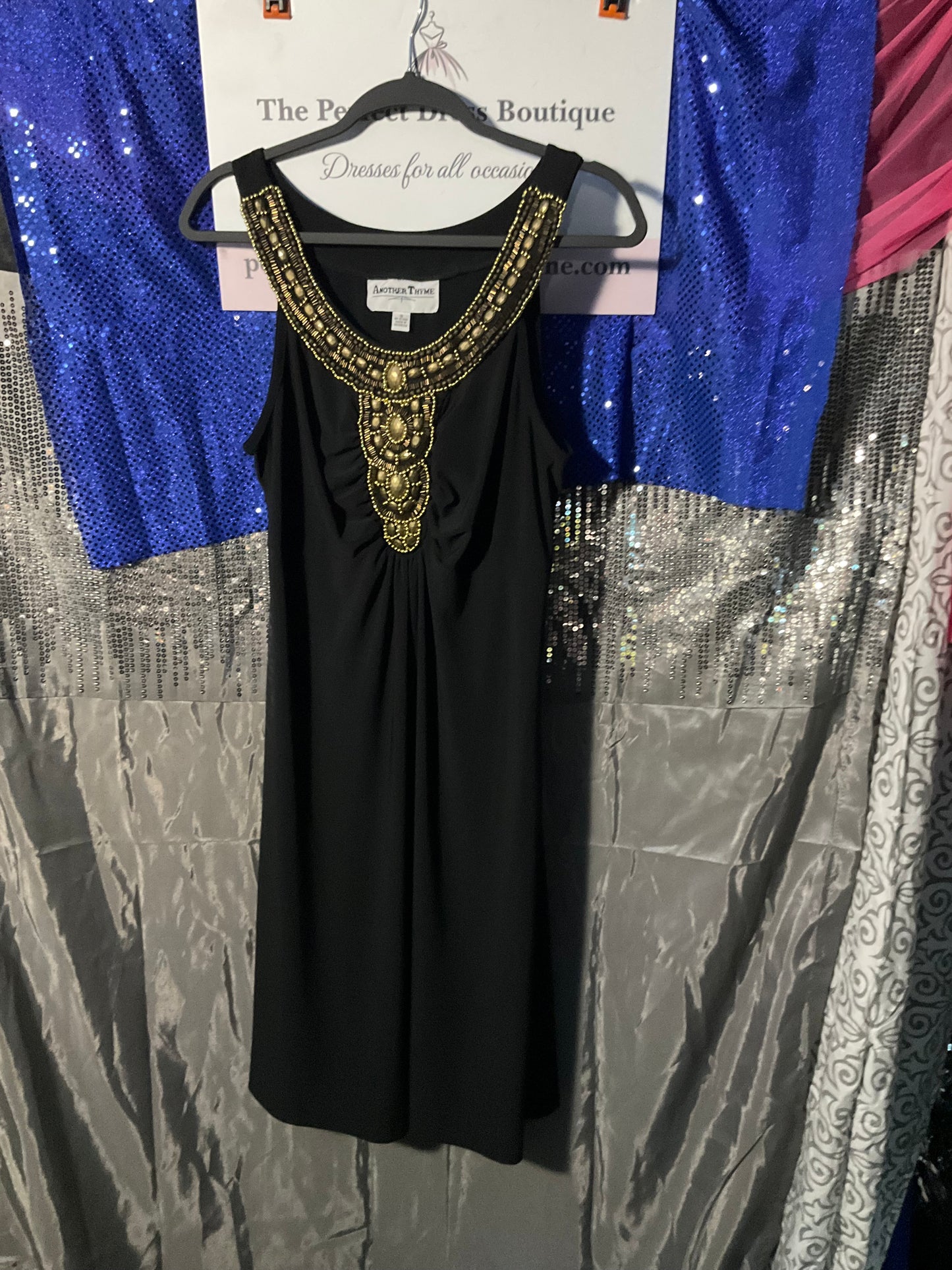 Black dress with gold embellishments