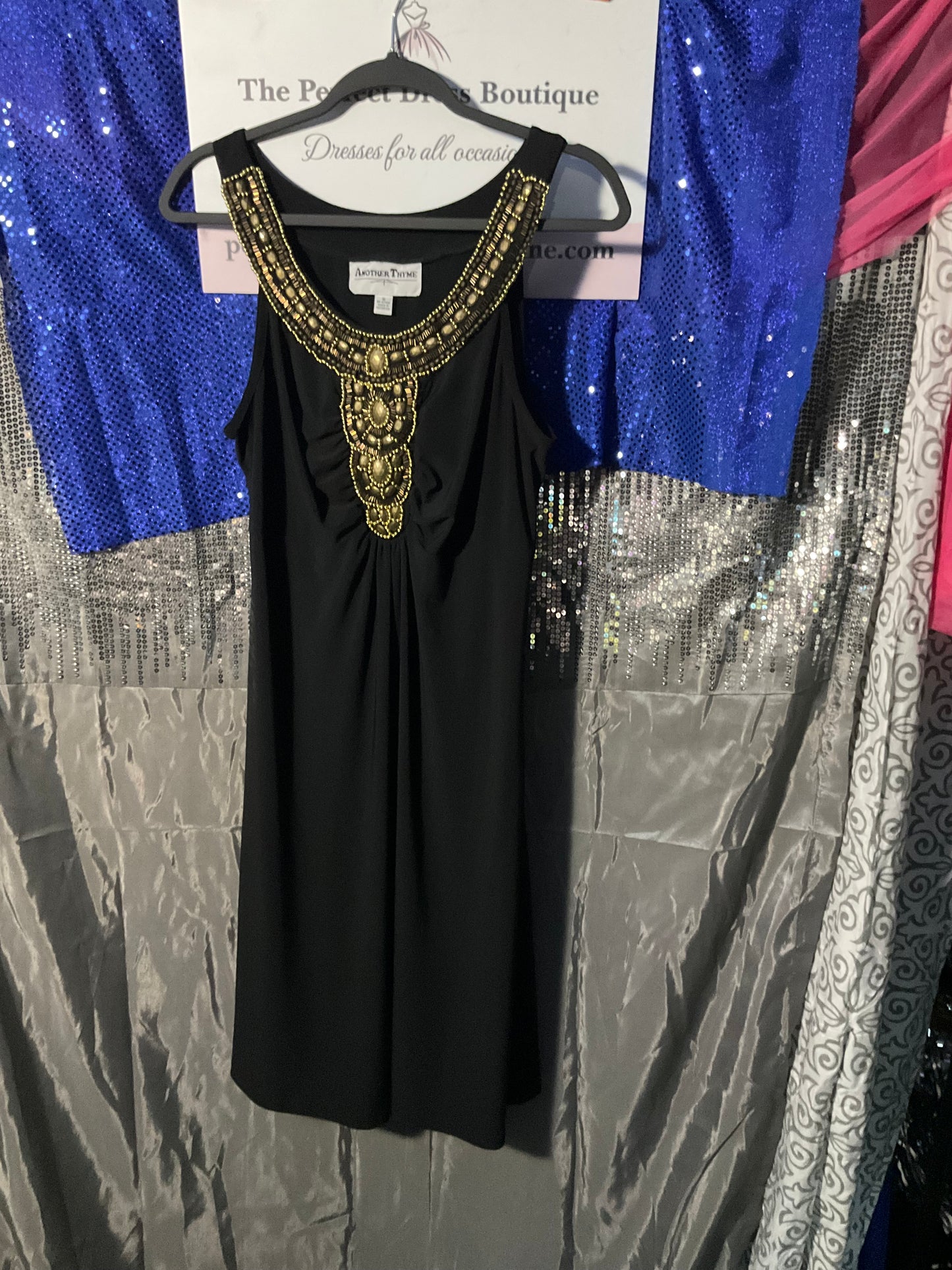 Black dress with gold embellishments